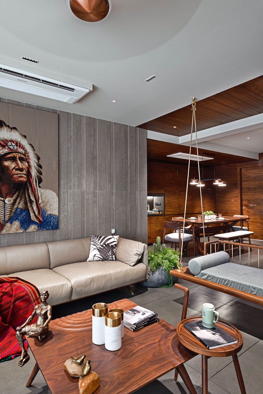 MA HOME living room with chief portrait artwork and timber swing