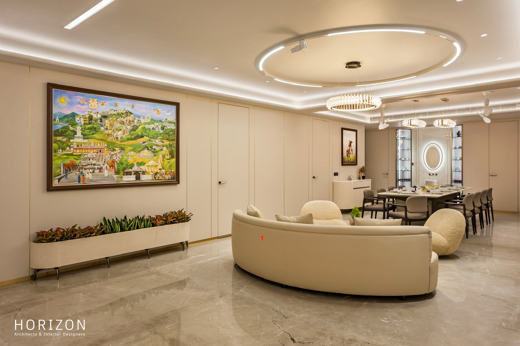 RAHUL BHAI HOME living room with a large folk-art painting, curved sofa and the dining table beyond