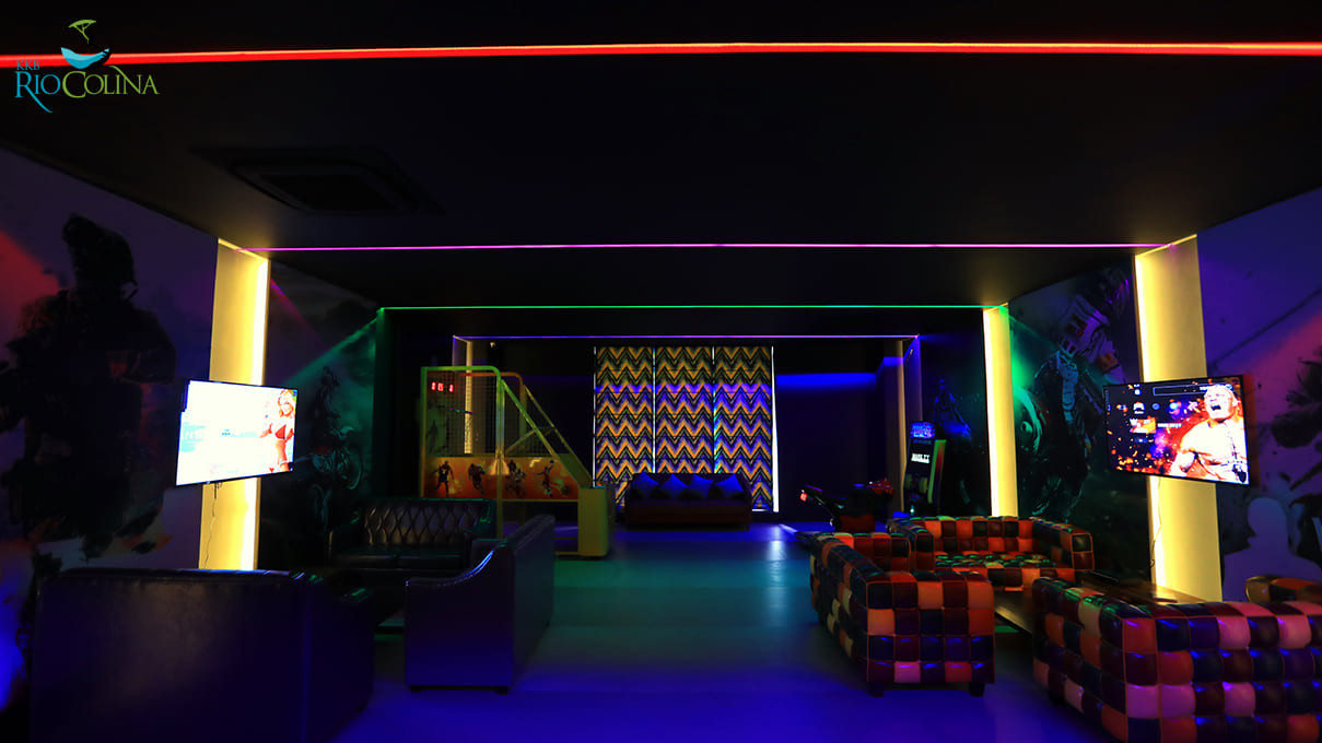 Gaming lounge with patchwork sofas and screens
