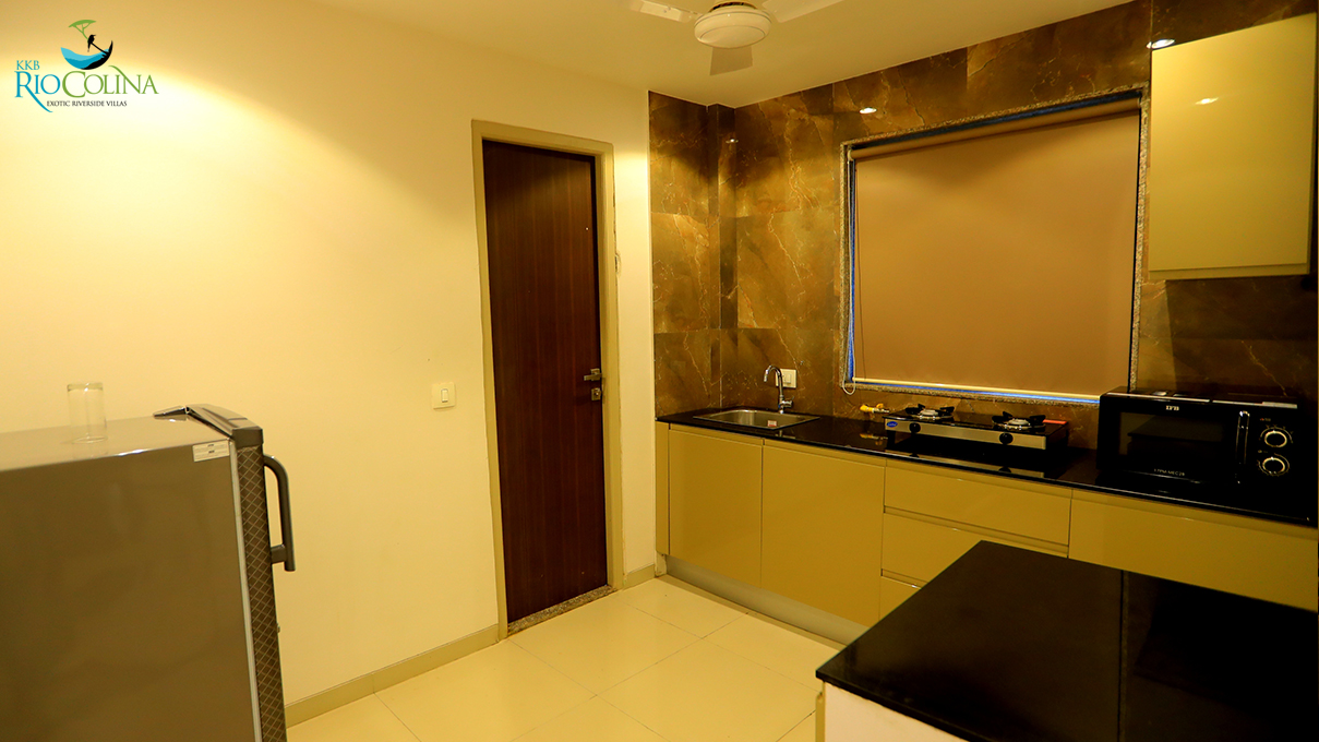 Villa kitchen with marble splashback and olive cabinets