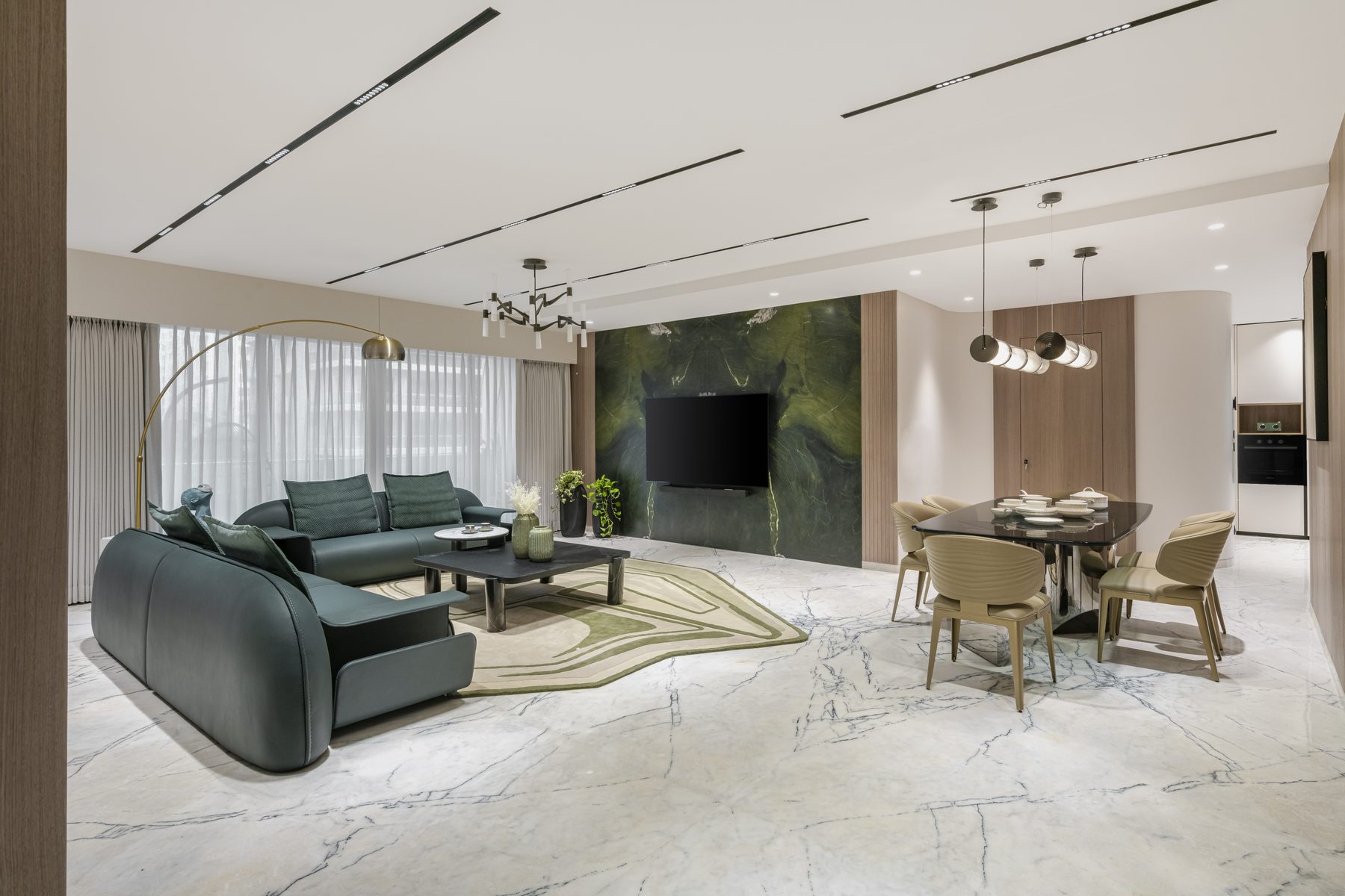 SACHIN BHAI HOME living room with green marble feature wall