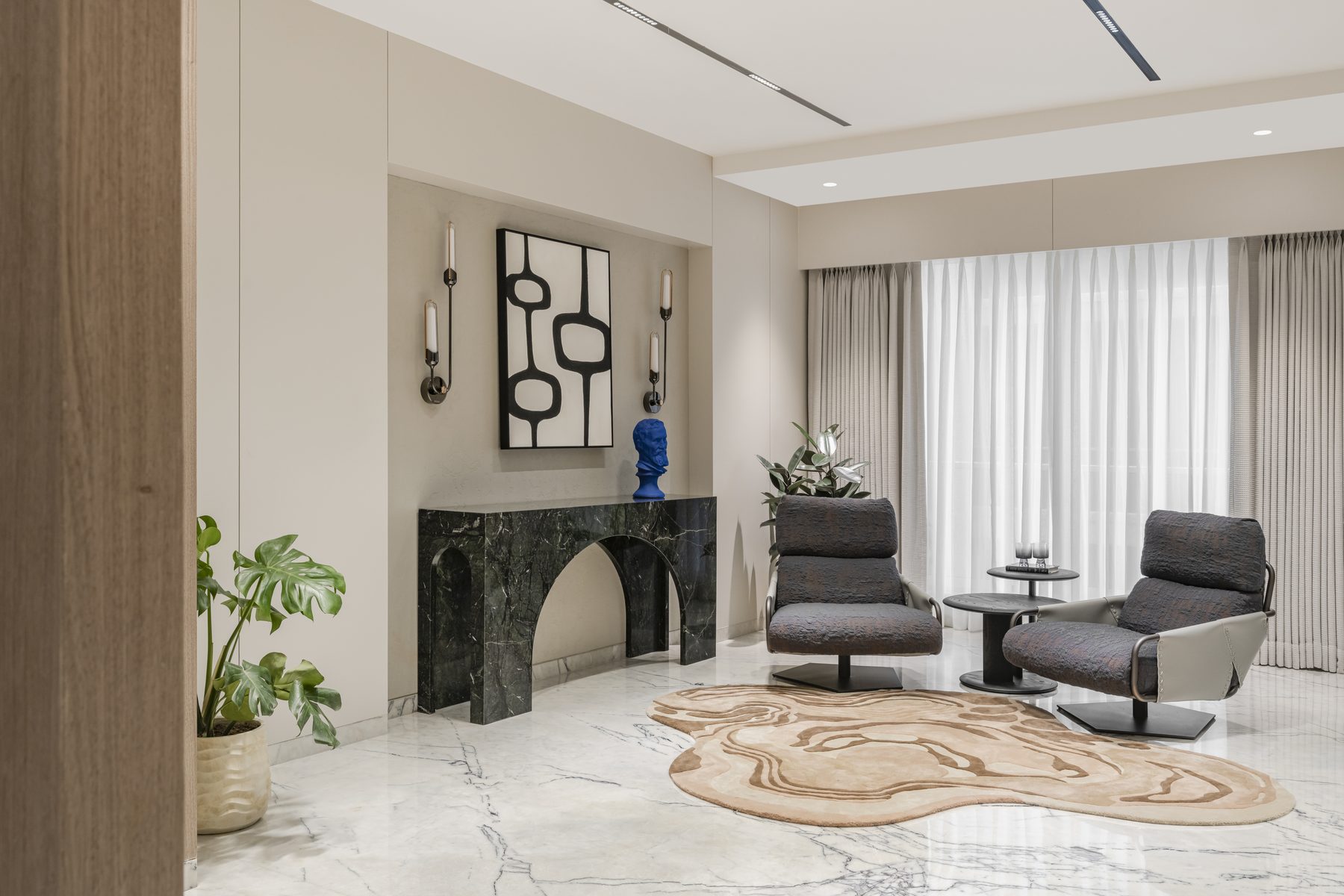 SACHIN BHAI HOME formal lounge with black marble arch console and swivel armchairs