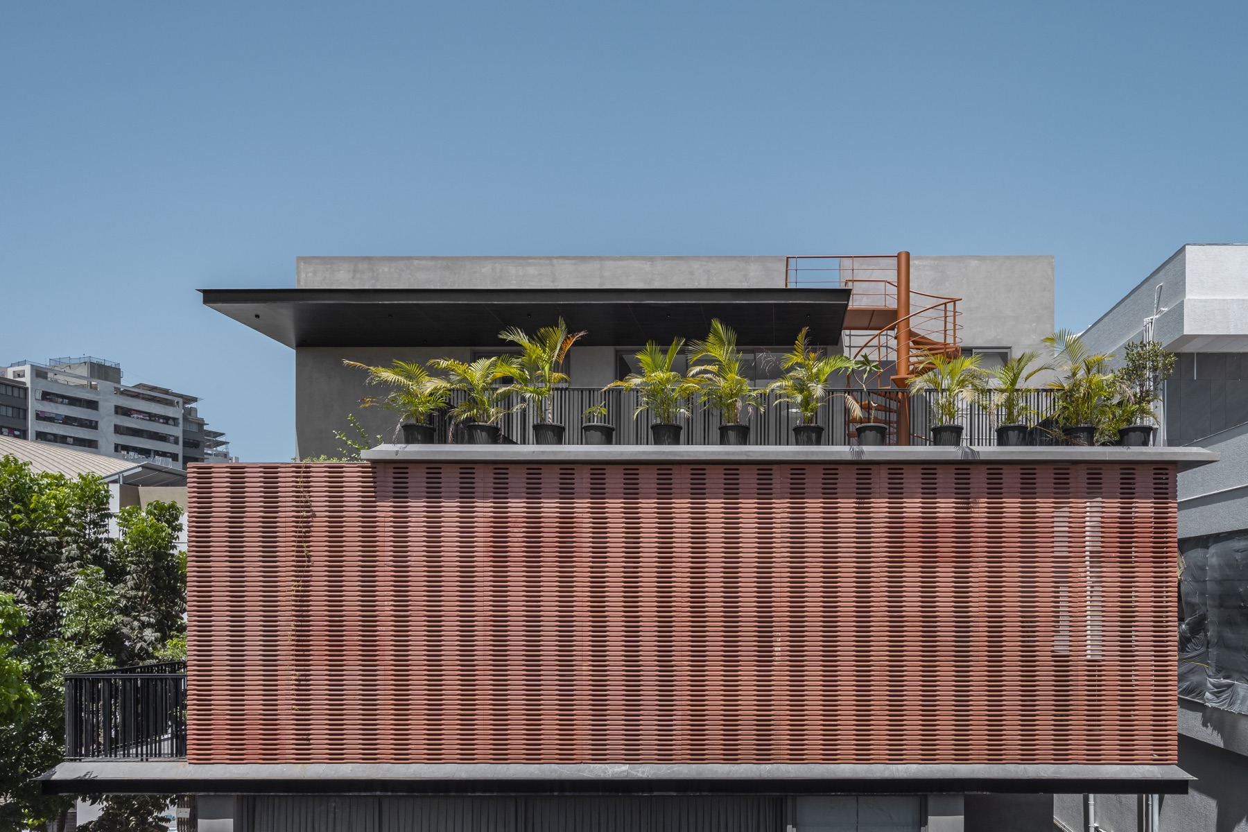 SHRI HOME terracotta-screened facade