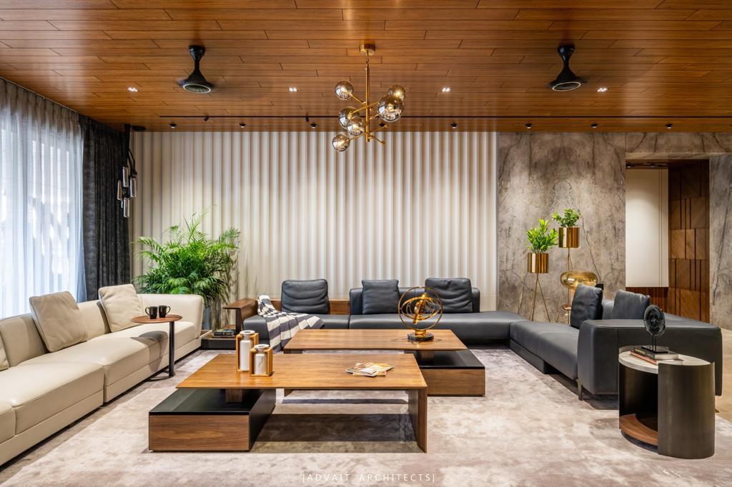 VILLASHBHAI HOME family living room with cream and navy sectionals under a timber ceiling