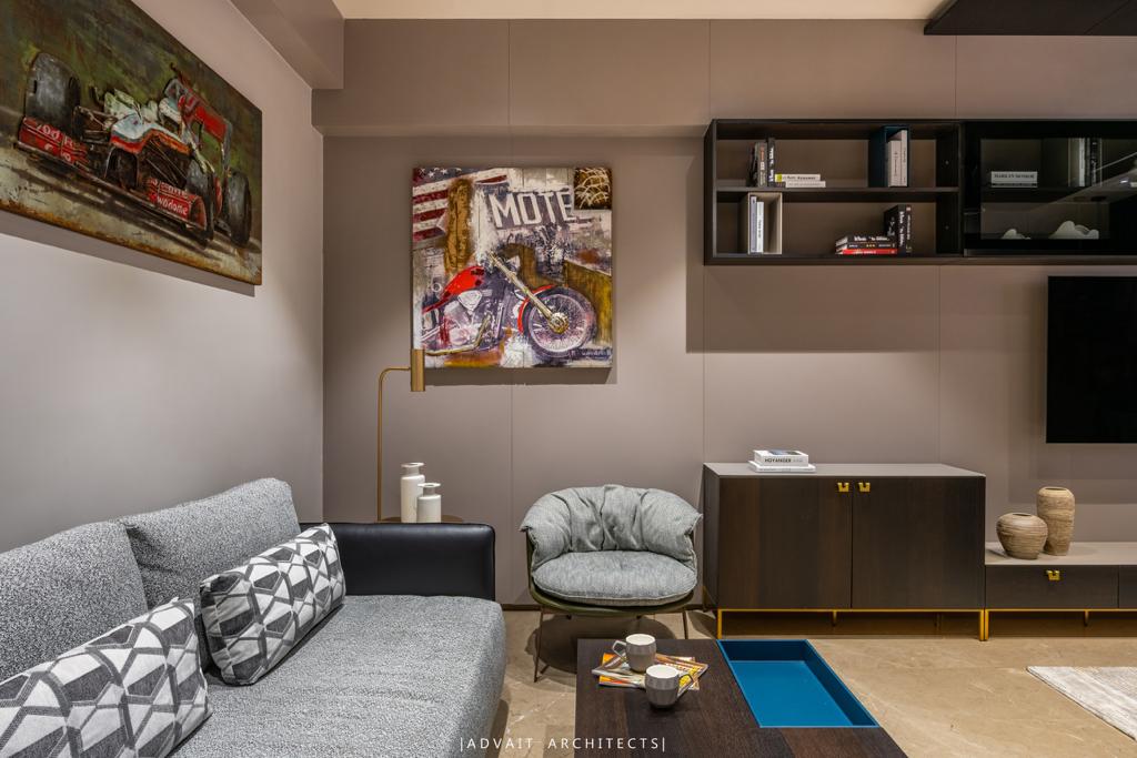 VILLASHBHAI HOME den with grey sofa, framed artwork and a long timber console