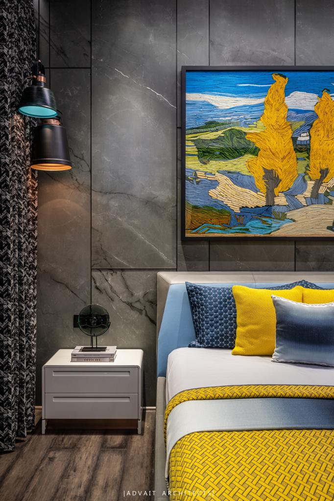 VILLASHBHAI HOME bedside with framed landscape artwork, task lamp and yellow bedding
